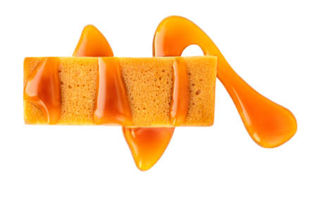 Caramel and honey bar with caramel sauce isolated on white background. Top viewの写真素材