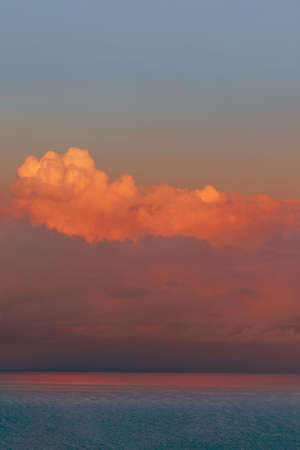 Sunset seascape with dramatic sky and colorful clouds. Fantastic view of the dark overcast sky and...