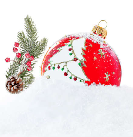 Christmas Red Ball with Tree Decorations, Pine cone and and frosty snow isolated on white background. Festive Xmas cardの写真素材