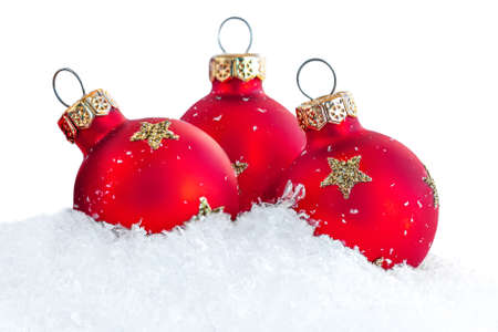 Christmas greeting card with Christmas Decorations, snow and red Balls isolated on white backgroundの写真素材