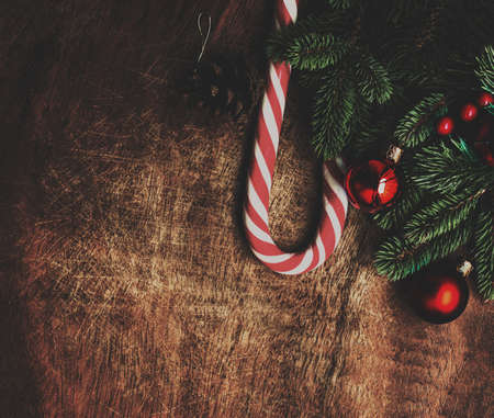 Vintage Christmas background with fir tree and decorations. Top view, copy space. Xmas card, New year poster.の写真素材