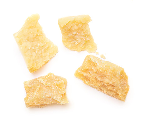 Pieces of parmesan cheese isolated on white background. Pattern. Set. Parmesan top view. Flat lay.の写真素材