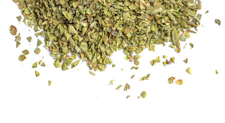 Dried oregano spice isolated on white background. Pile of dry oregano or marjoram leaves top viewの写真素材