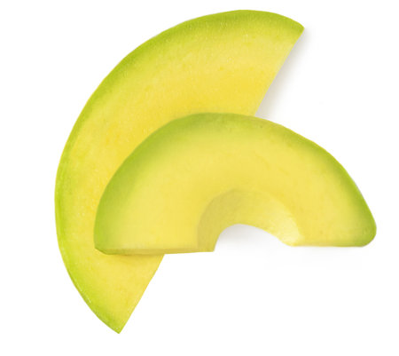 Sliced Avocado isolated on white background. Top view avocado piecesの写真素材