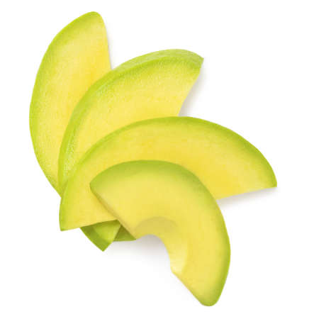 Avocado slices isolated on white background. Top view avocado fruit piecesの写真素材