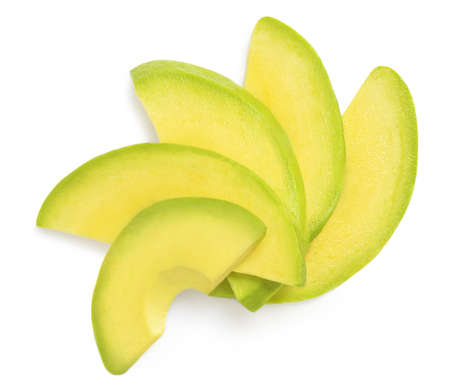 Avocado slices isolated on white background. Top view avocado pieces. Flat layの写真素材