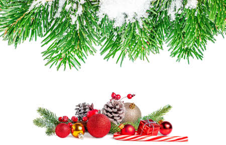 Christmas background with fir branches and decorations isolated on white background.の写真素材