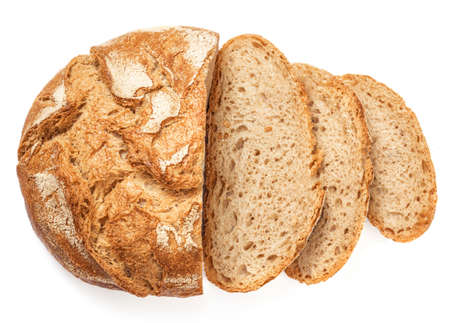 Freshly baked round Bread isolated on white background. Sliced, cutted wheat bread. Bakery, rustic traditional food concept. Top viewの写真素材