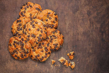 Chocolate cookies on dark wooden background. Brown Chocolate chip cookies top view,の写真素材