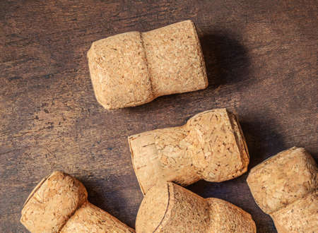 Wine corks closeup on a wooden table. Wine, festive concept. Top view. Flat layの写真素材