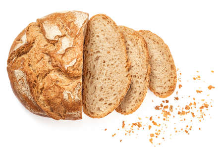 Wholegrain Organic Bread with crumbs isolated on white background. Sliced, cutted wheat bread.の写真素材