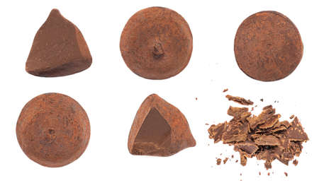 Chocolate truffles candies covered with cocoa isolated on white background. Truffle whole and bitten pieces top viewの写真素材