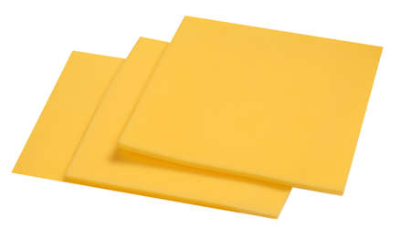 Sliced Cheese isolated on white background, top view. cutted cheese closeupの写真素材