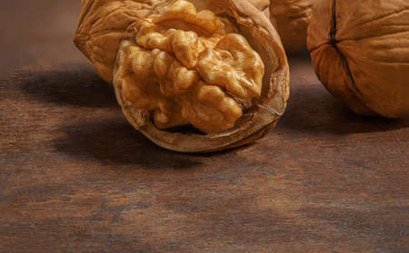 Walnuts on a wooden table. Walnut background close upの写真素材