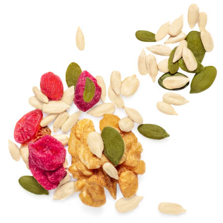 Nuts and sunflower seeds isolated on white background. Creative layout made of granola Flat lay.の写真素材