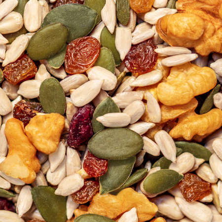 Nuts and seeds as a background. Pattern of granola or muesli Top view