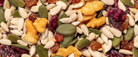 Nuts and seeds as a background. Pattern of granola or muesli Top viewの写真素材