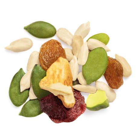 Nuts and seeds isolated over the white background. Creative layout made of granola or muesli Flat lay.の写真素材