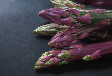 Asparagus. Fresh organic asparagus on black background. top view. copyspace. Healthy diet food conceptの写真素材