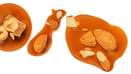 Caramel with almond nuts and caramel sauce isolated on a white background close up. top view. flat layの写真素材