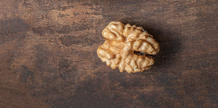 Peeled Walnut on dark vintage table top view. Fresh Walnut kernels, copyspaceの写真素材
