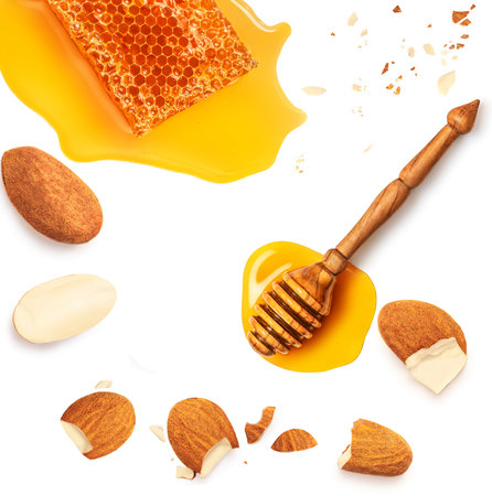 Creative layout made of Honeycomb with flowing honey syrup and dipper isolated on white background. Honey flat lay. food concept.の写真素材