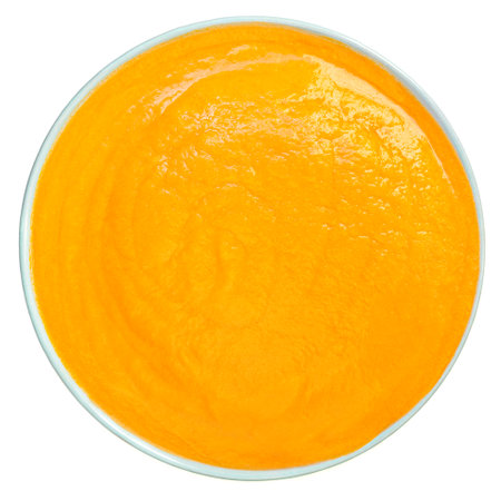 Pumpkin or Squash Cream soup isolated on a white background. Bowl of Autumn cream-soup Top view.の写真素材