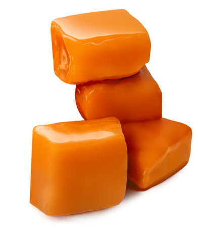Sweet Caramel toffee candies with caramel sauce isolated on a white background close up. Candy Collection.の写真素材