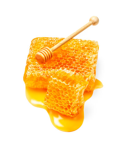 Honeycomb with honey drop on white background. Honey dipper Flat lay. food concept.の写真素材