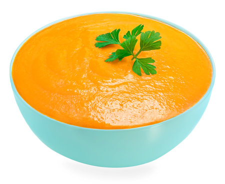 Squash soup isolated on a white background. Autumn pumpkin cream-soupの写真素材