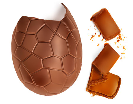 Crushed Chocolate Easter egg with chocolate candies isolated on white background, close up. creative layoutの写真素材