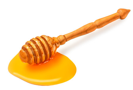 Honey dipper stick isolated on a white background.の写真素材
