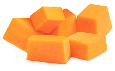 Raw Butternut squash slices isolated on white background. Pumpkin pieces cutted in a cubes close up.の写真素材
