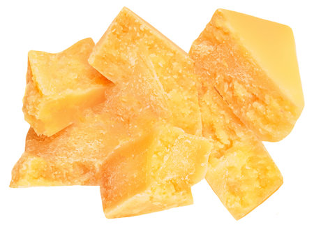 Parmesan cheese pieces isolated on white background. Hard mature cheese Parmigiano top view, flat lay.の写真素材