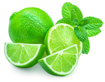 Lime isolated on white background. Lime citrus fruit with mint leaf and slices closeup. food compositionの写真素材