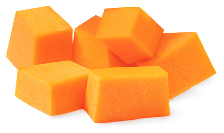 Diced Pumpkin isolated in white background. Fresh raw Pumpkin slices cut out, closeup.の写真素材