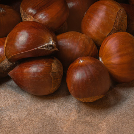Sweet Chestnuts Top view. Copy space. Pile of ripe chestnuts for food background closeupの写真素材