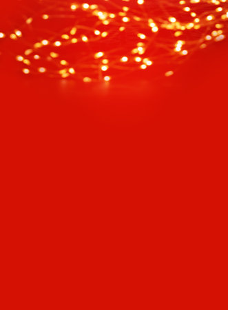 Red Christmas Background with Golden Glitter lightsの写真素材