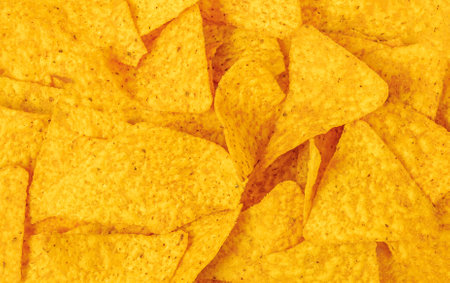 Nachos or tortilla chips texture background. Traditional Mexican food Top view. Patternの写真素材