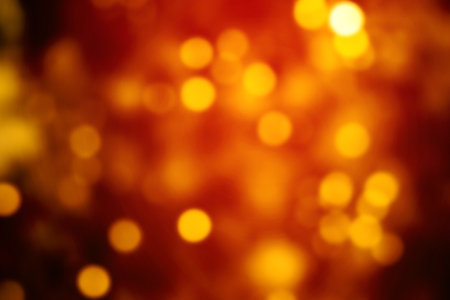 Red Christmas Background with Bokeh and Golden lights. Xmas wallpaperの写真素材