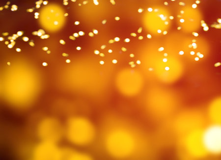Glitter Christmas Background with golden Bokeh lights. Xmas defocused patternの写真素材