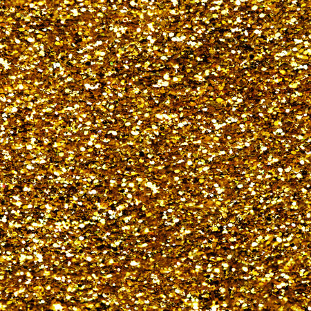 Gold glitter texture sparkling shiny background for Christmas card. Twinkly golden glitter lights grunge backgroundの写真素材