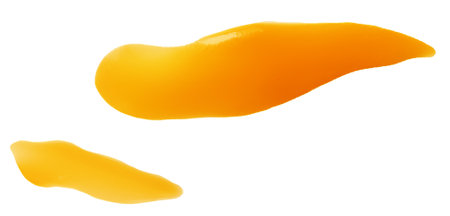 Flowing melted caramel syrup drops isolated on white background.の写真素材