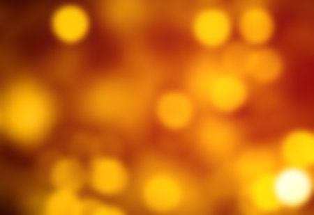 Red Christmas Background with golden Bokeh lights. Xmas defocused wallpaperの写真素材