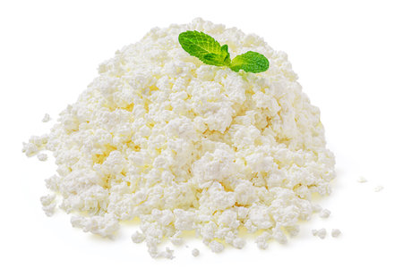 Cottage cheese isolated on white background. Fresh cottage Cheese (curds or whey) is a curdled milk, diary product. Close upの写真素材
