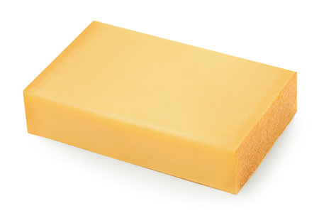 Piece of cheese isolated on white background. Comte cheese close up. High resolution imageの写真素材