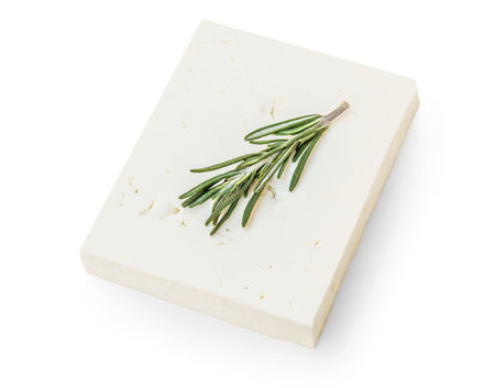 Feta cheese on isolated on white background, top view. Fesh Greek feta cheese block with rosemary herbs close upの写真素材