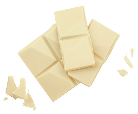 White chocolate bar pieces isolated on white background. Milk chocolate with crumbs top view. Flat lay. Package design elementsの写真素材