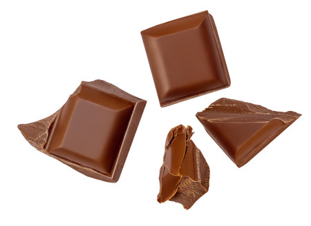 Broken chocolate piece explosion Dark Chocolate pieces isolated. Levitating Chocolate pieces on white background as package design elements.の写真素材