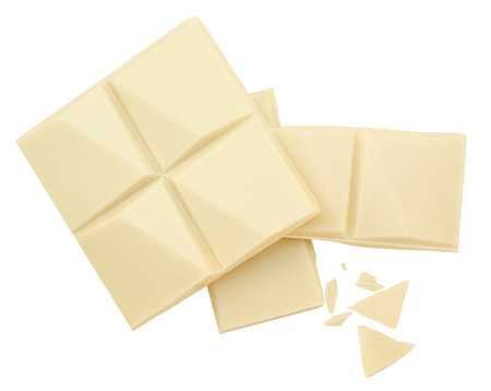 White chocolate bar pieces isolated on white background. Broken Milk chocolate top view. Flat lay. Package design elementsの写真素材